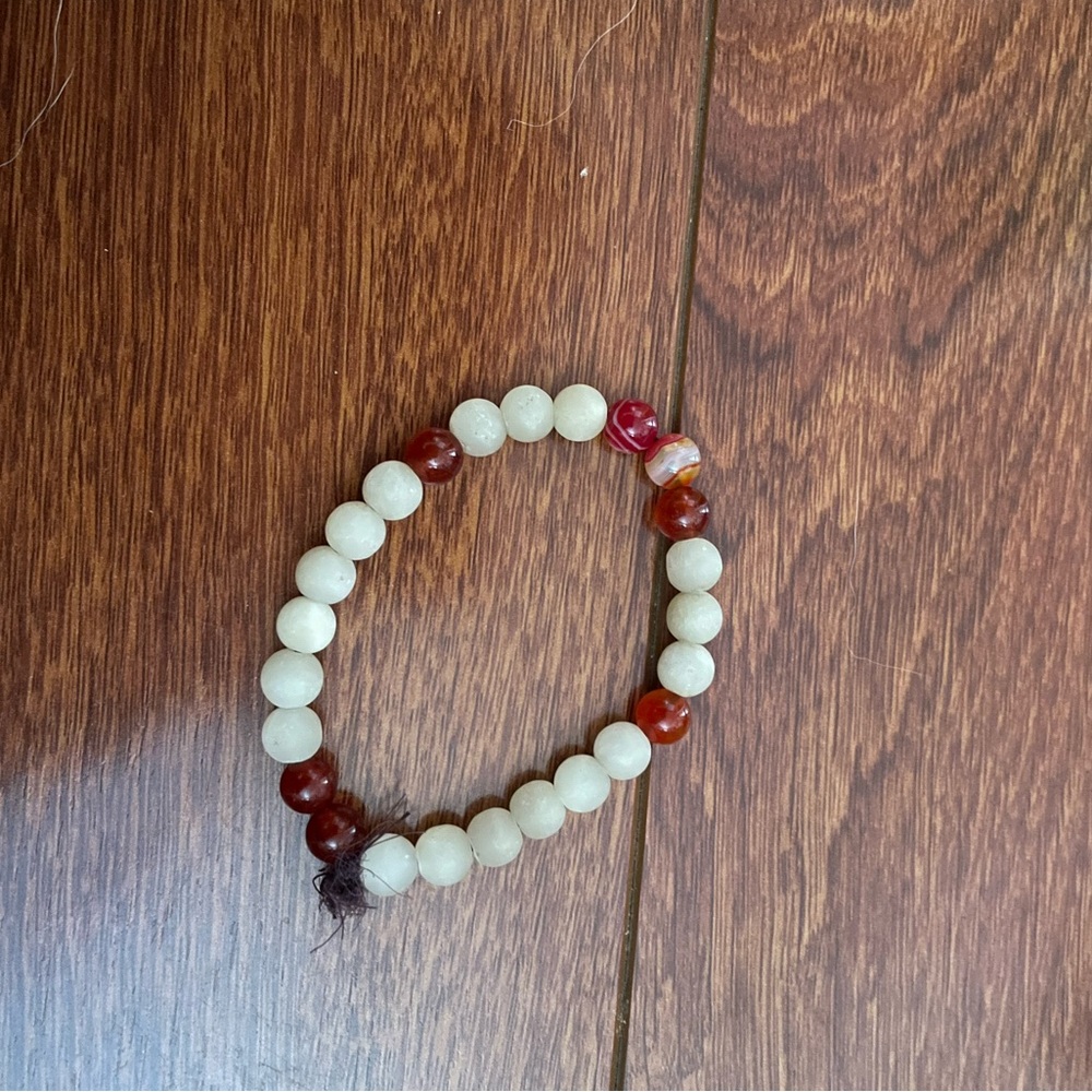 Elegant Beaded Bracelet with Red and White Accents